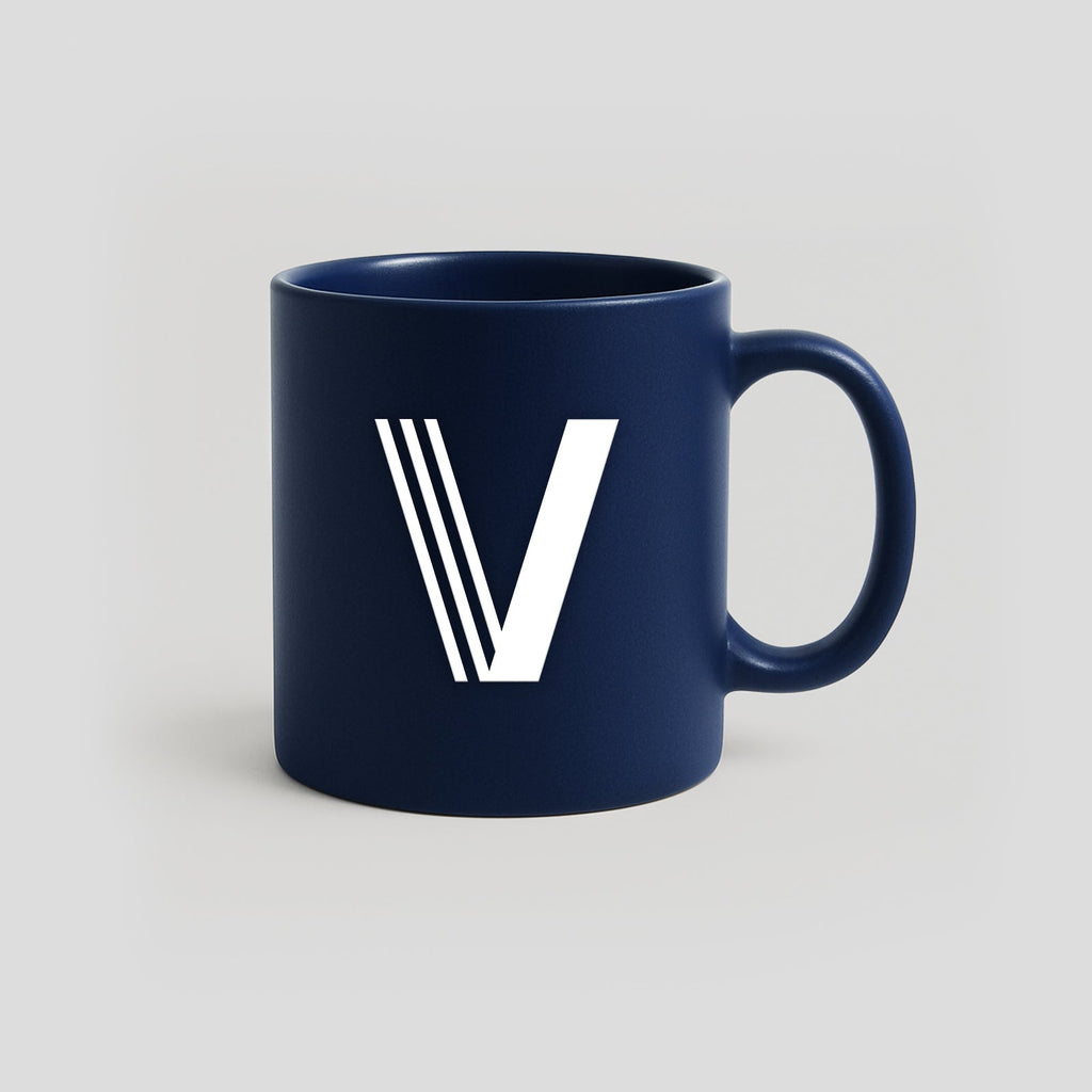 Navy blue mug with a white V logo